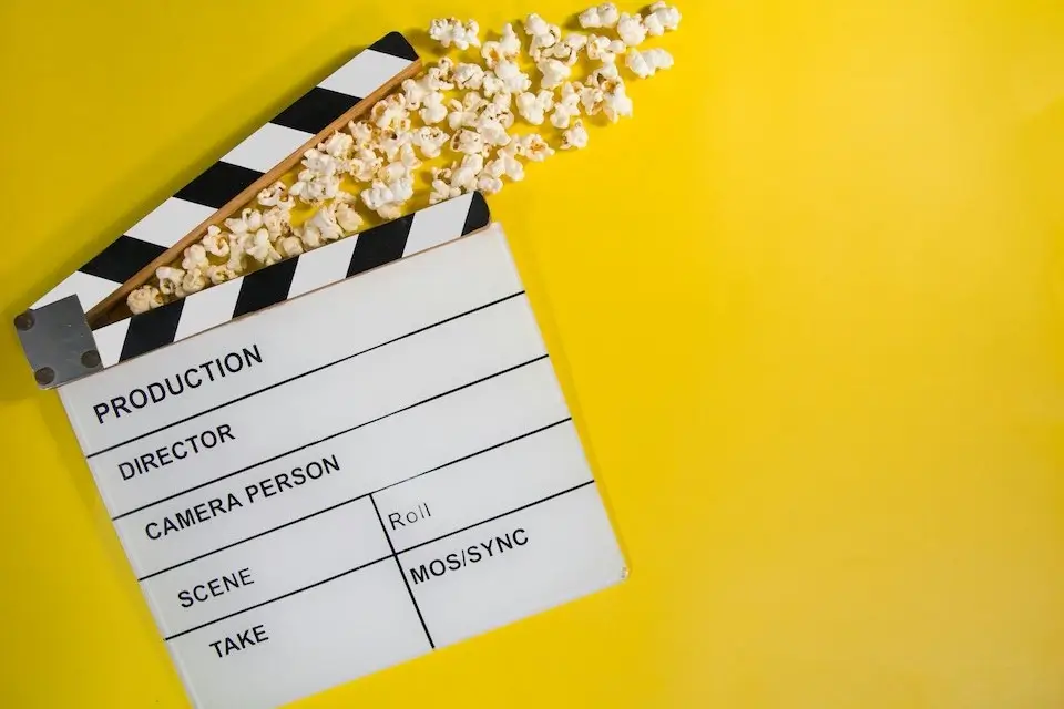 stinkwater-film-festival-2 clapboard and popcorn on a yellow background