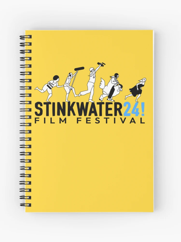 women holds a clapboard in front of her face